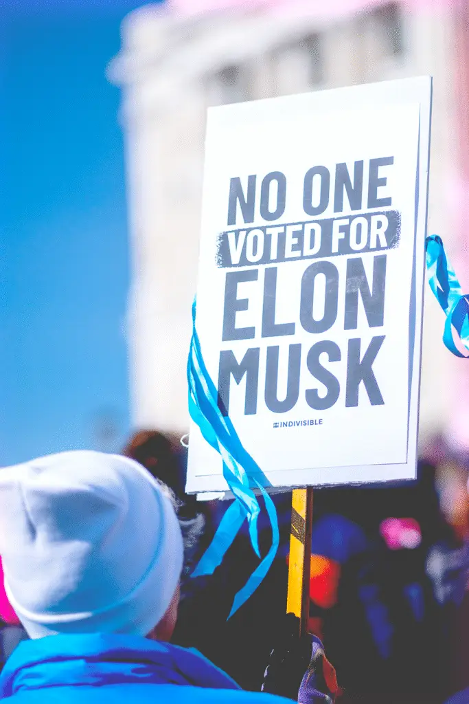 protest sign against Elon Musk